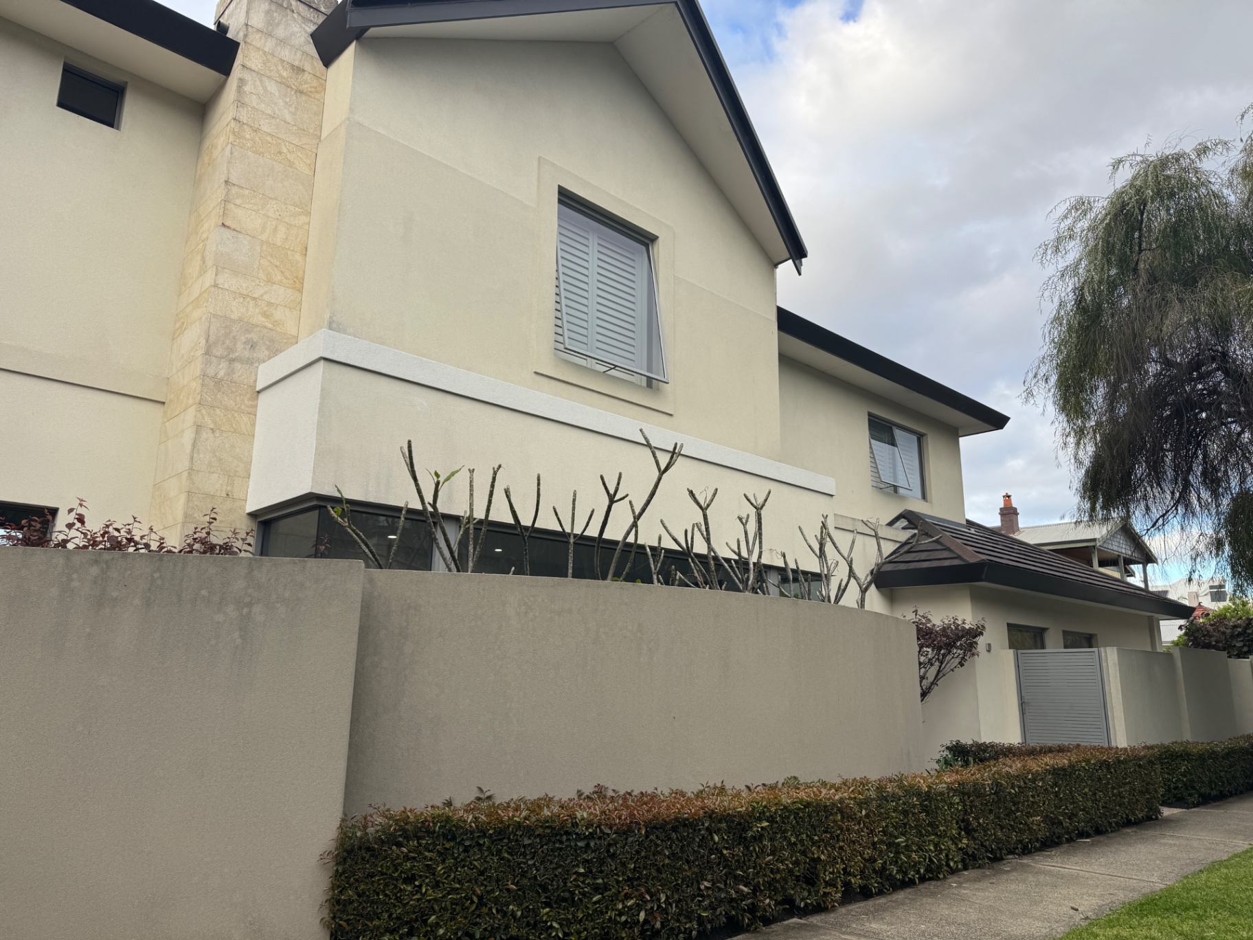 Cottesloe home before works, showing weathered cream render