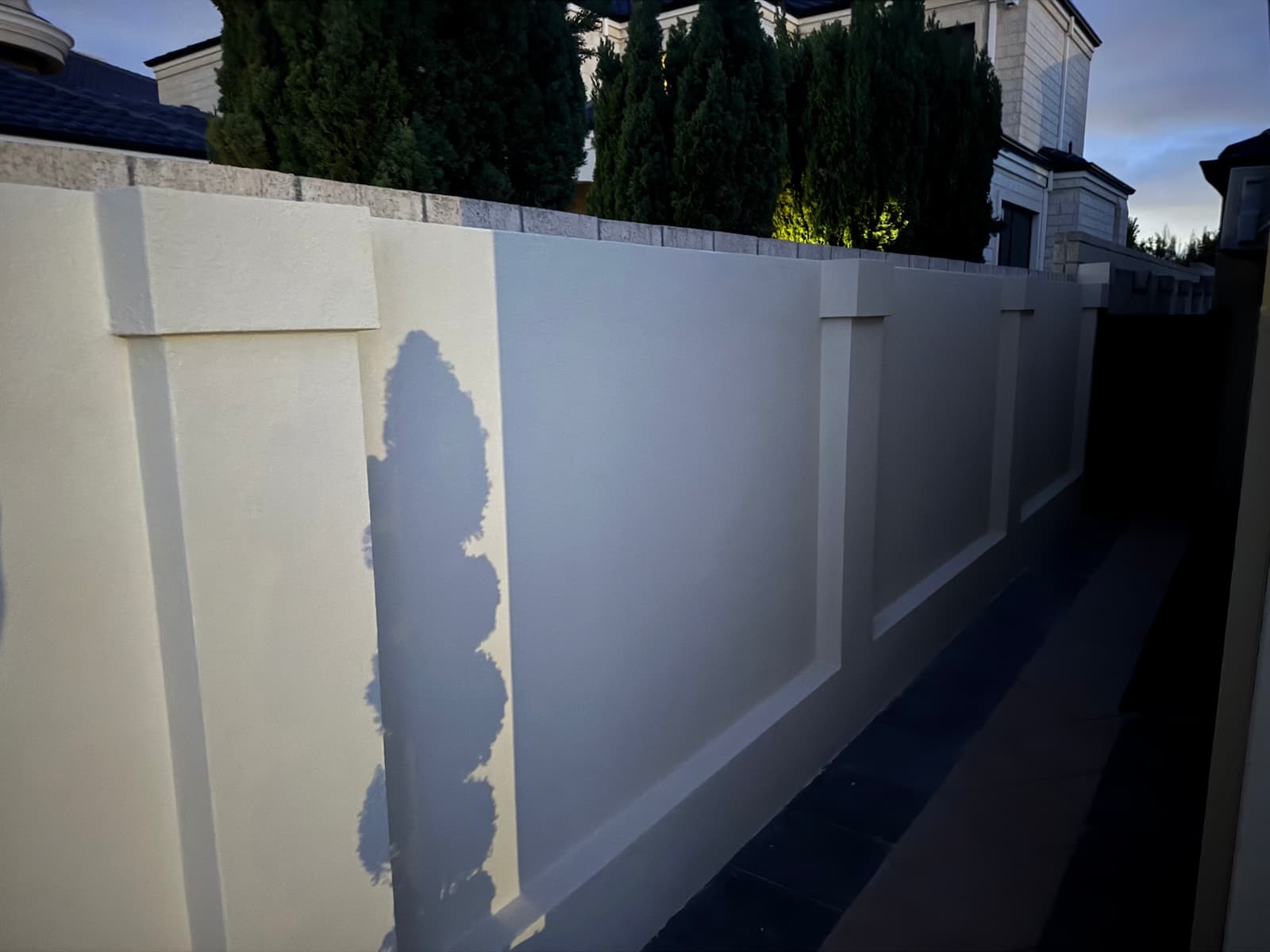 Sorrento boundary wall after re-texture and AcraShield finish coat in a consistent off-white