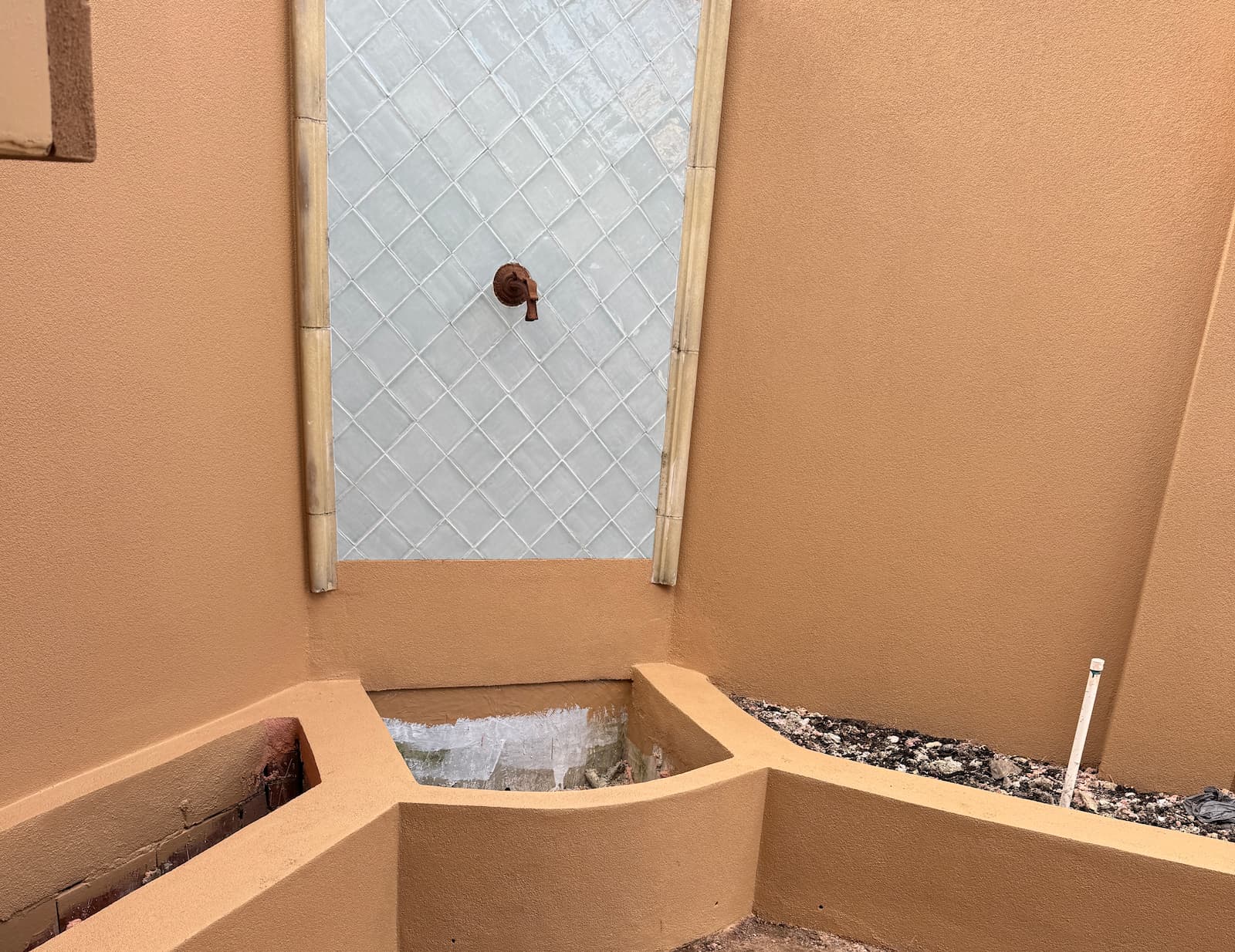 Bicton courtyard corner after re-texture and AcraShield finish in a warm sand colour