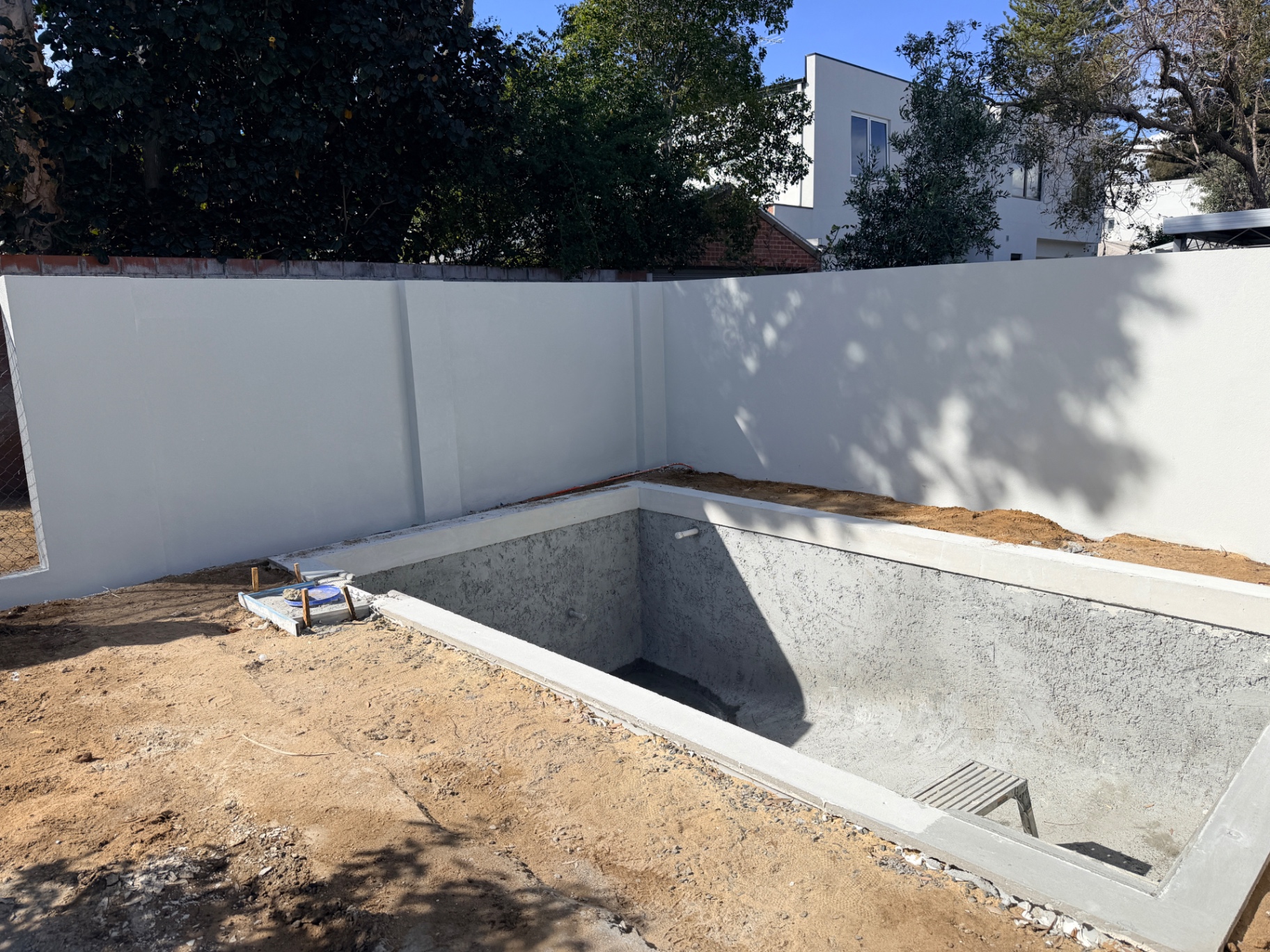 Completed Swanbourne pool boundary wall after texturing and Dulux AcraShield coating