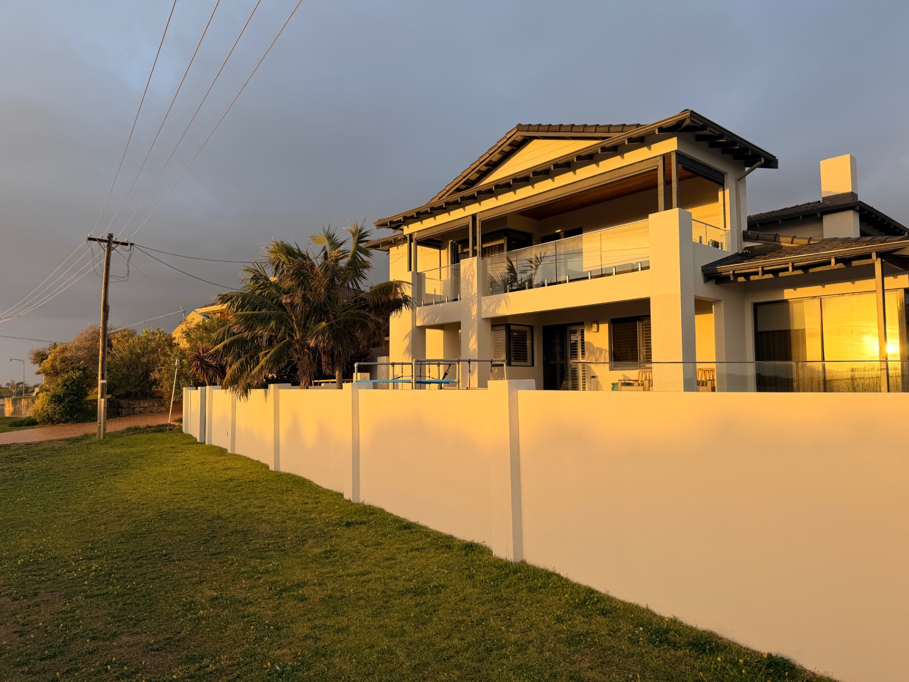 Coastal home after full re-texture and AcraShield re-coat in a new off-white colour