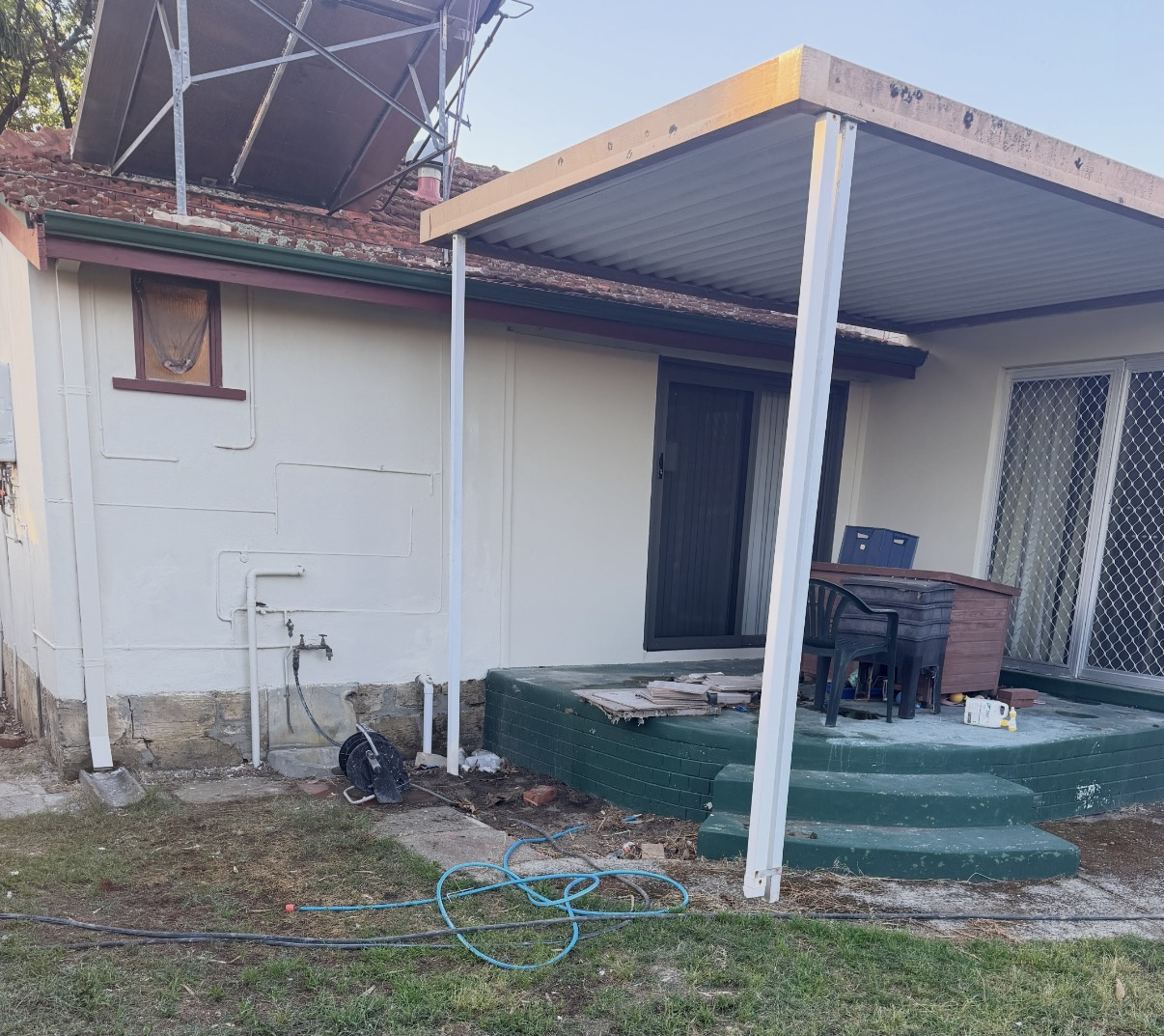 Wide view of the Victoria Park home after the rear render was restored and painted
